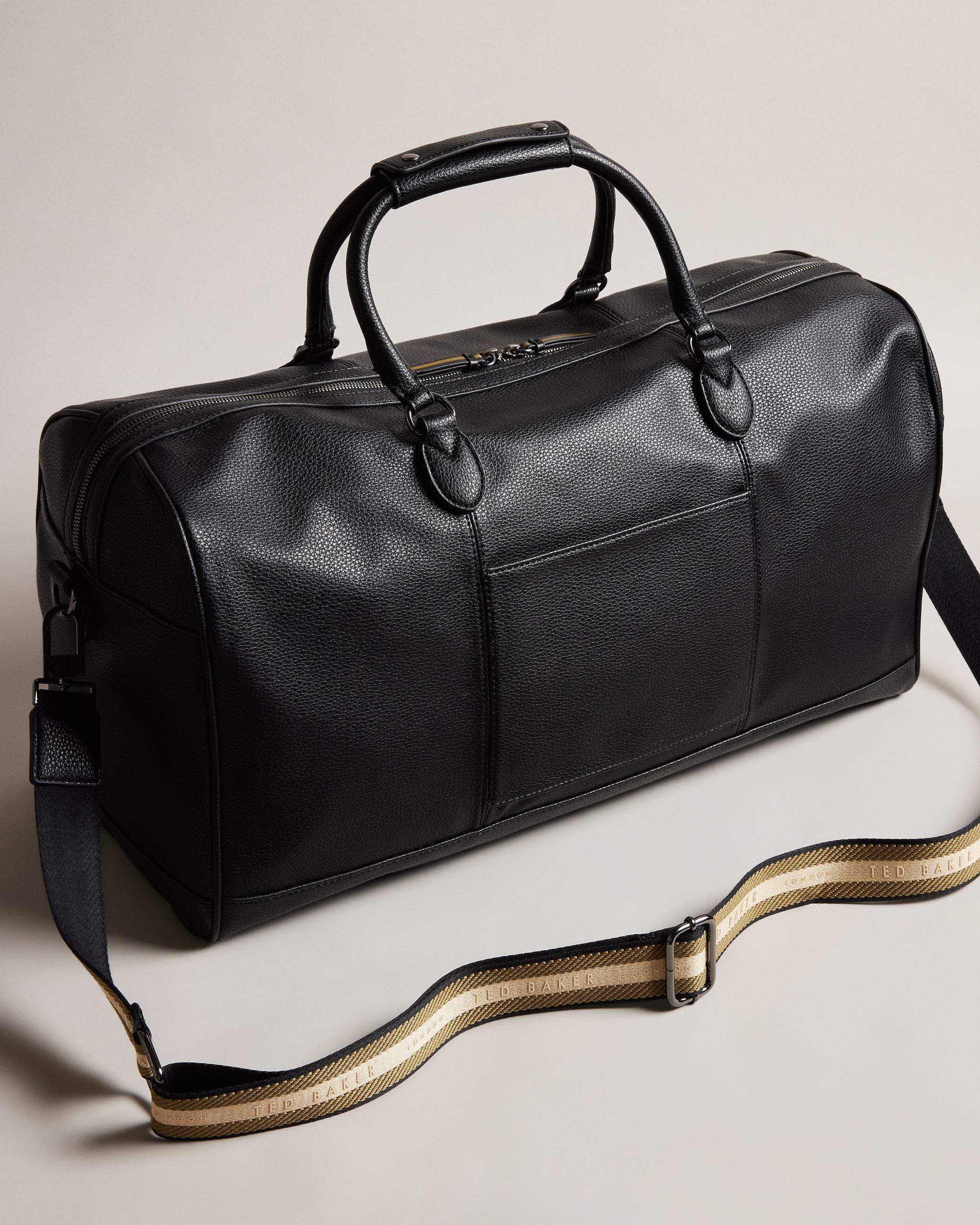 Kalvin Faux Leather Webbing Strap Holdall