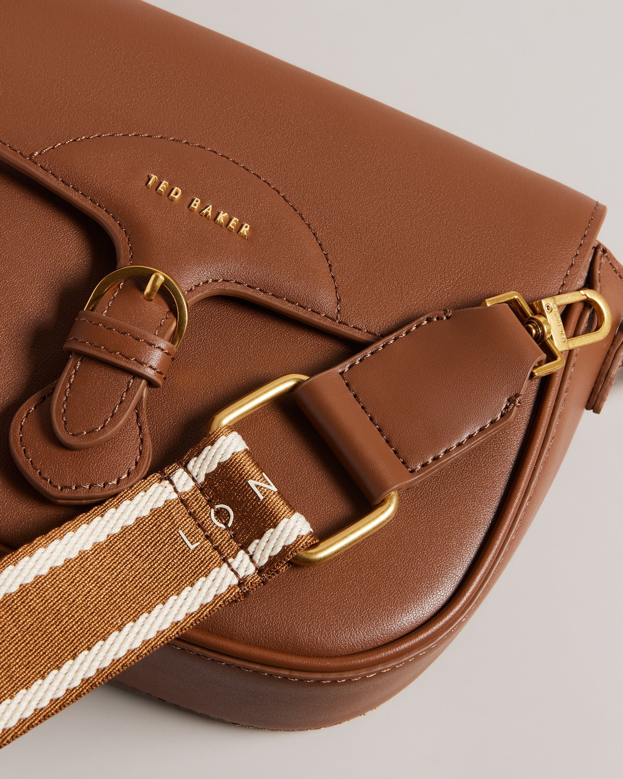 Esia Webbing Crossbody Saddle Bag Brown
