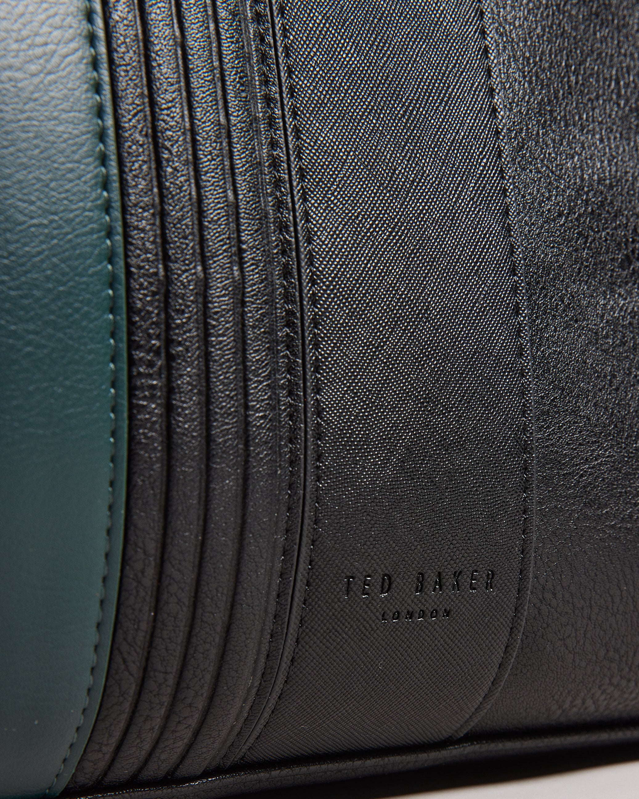 Evian Striped Faux Leather Bowler Bag Black