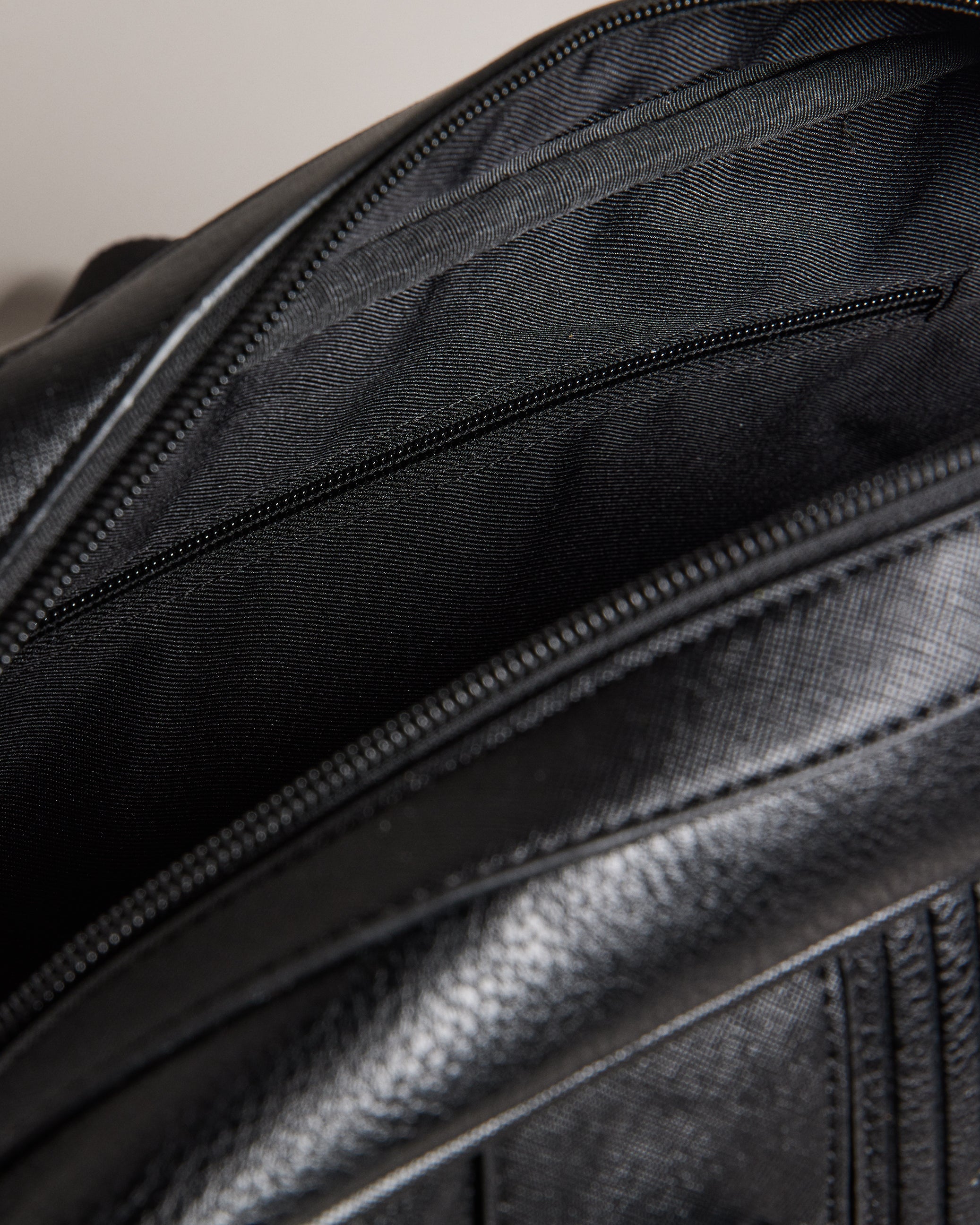 Evian Striped Faux Leather Bowler Bag Black