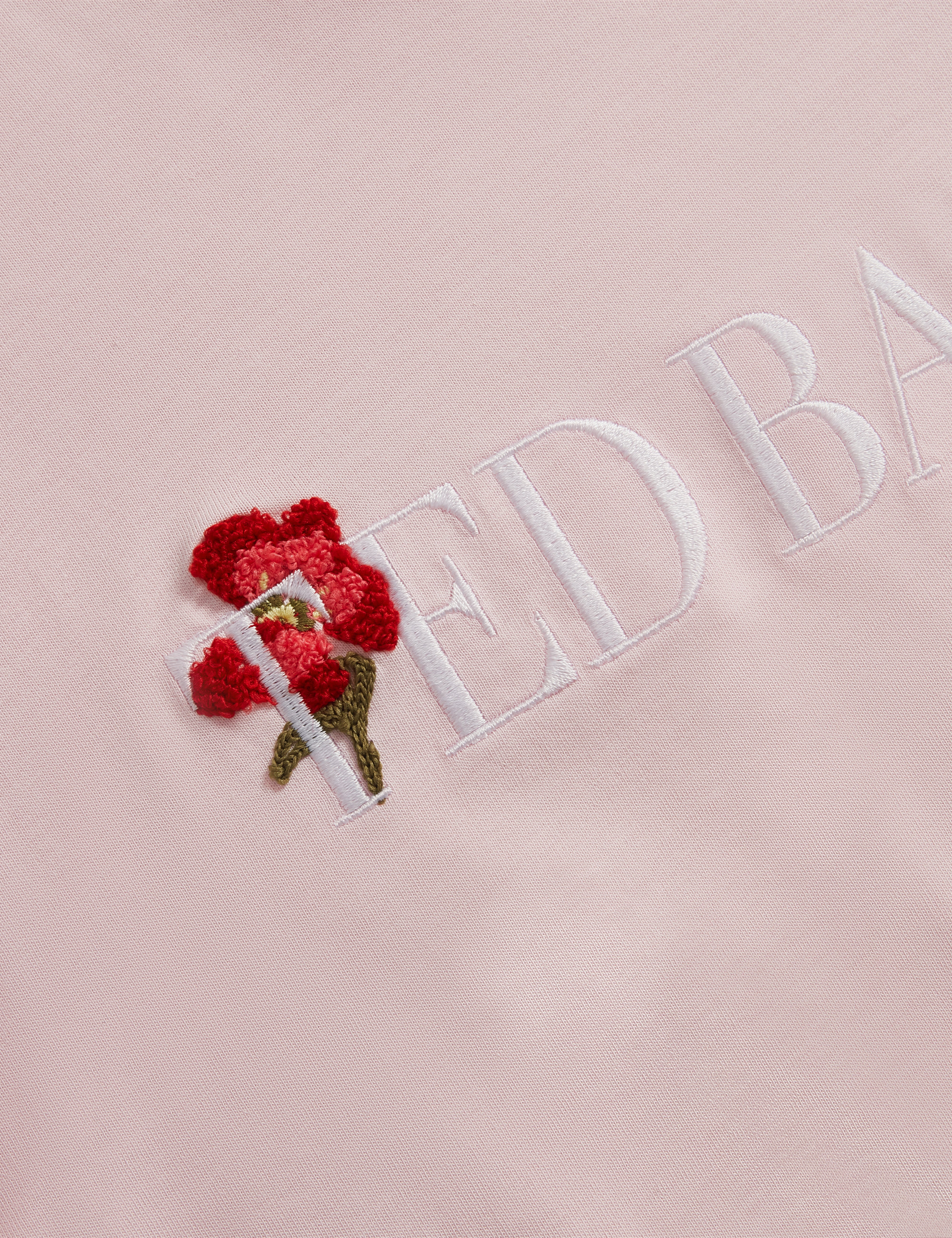 مولي تيشيرت بعلامة تيد بيكر لون وردي فاتح