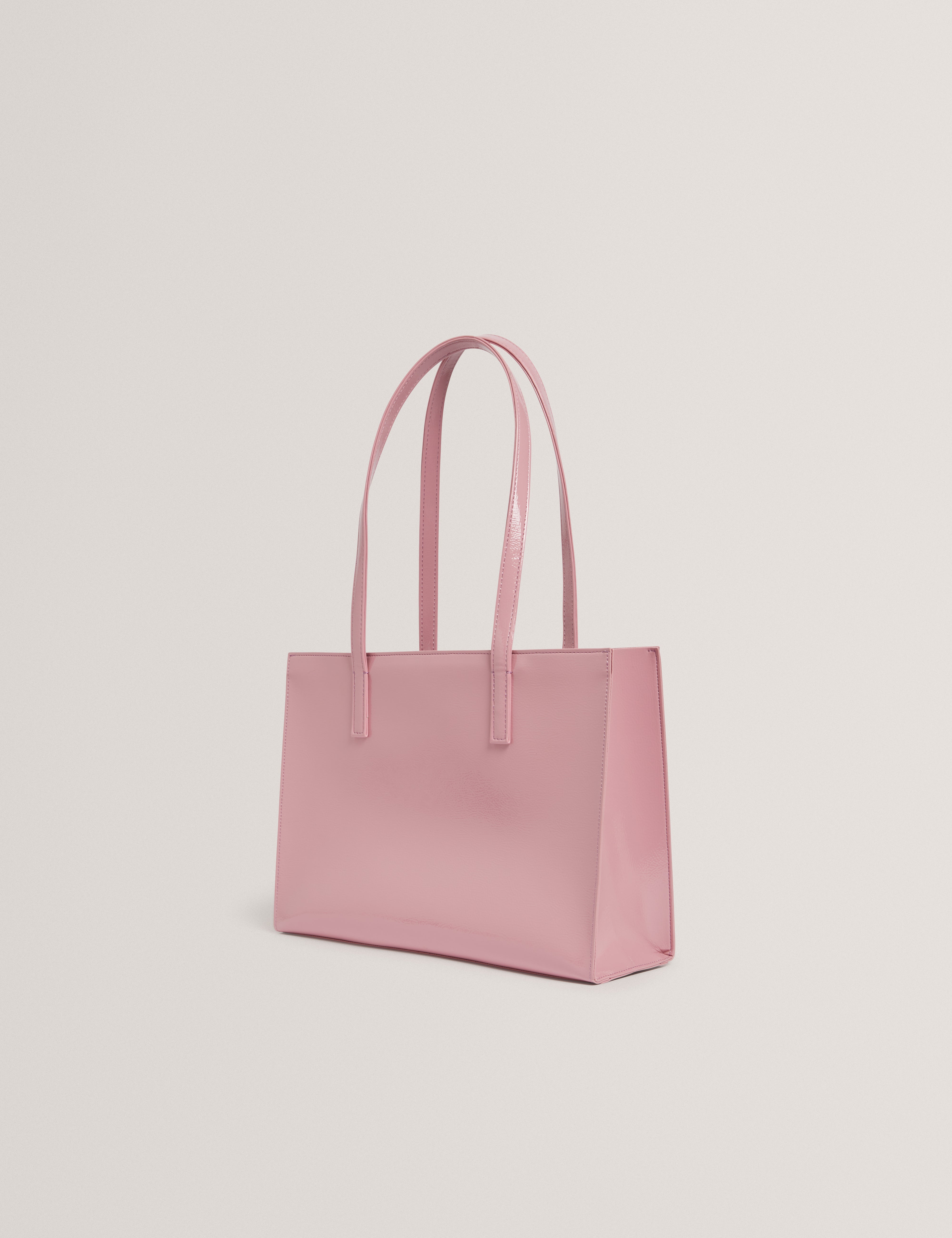 حقيبة كرينيل إي/دبليو كرينغ إيلونجتيد أيقونية وردية اللون