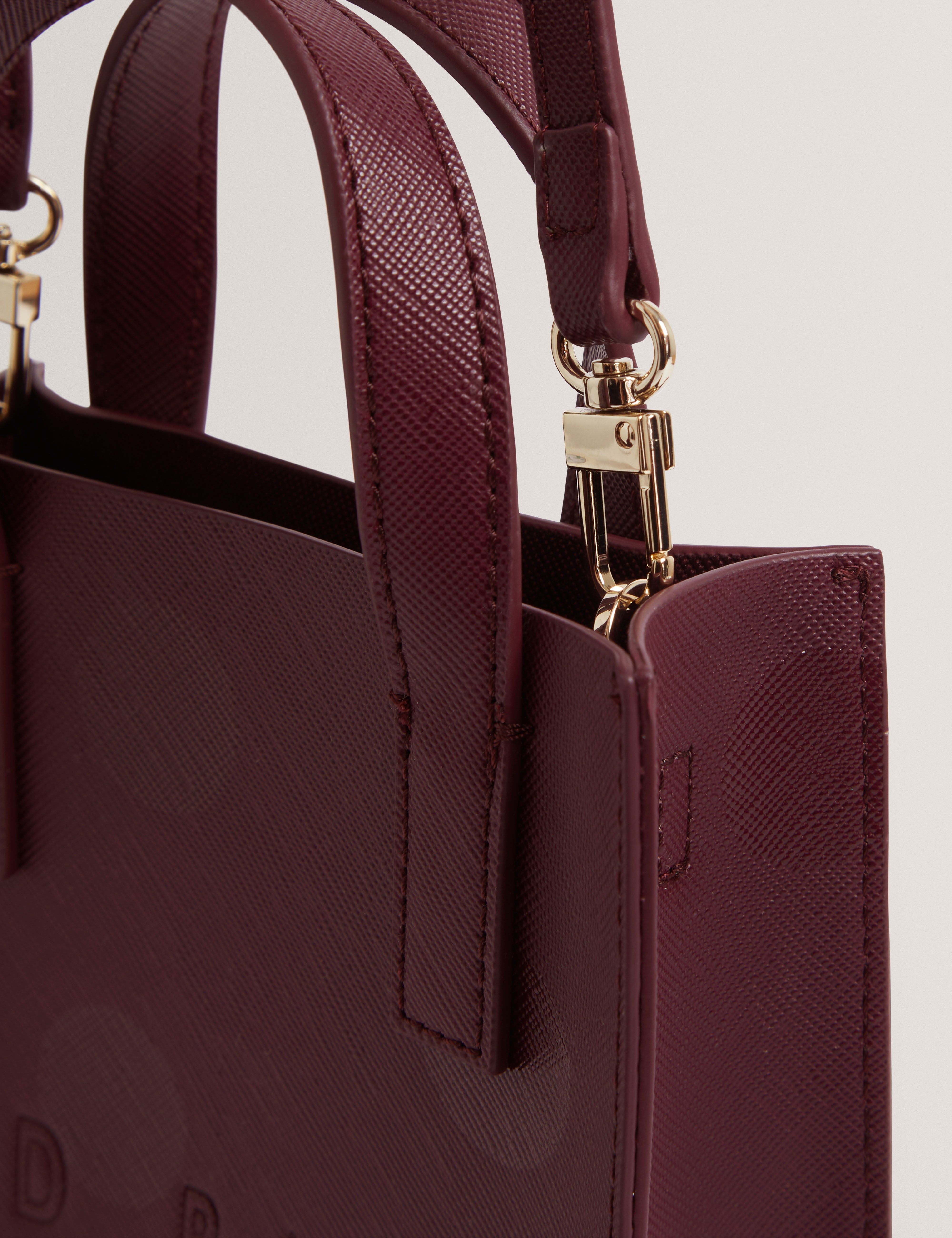 دوتانا حقيبة أيقونية صغيرة باللون الأرجواني الداكن