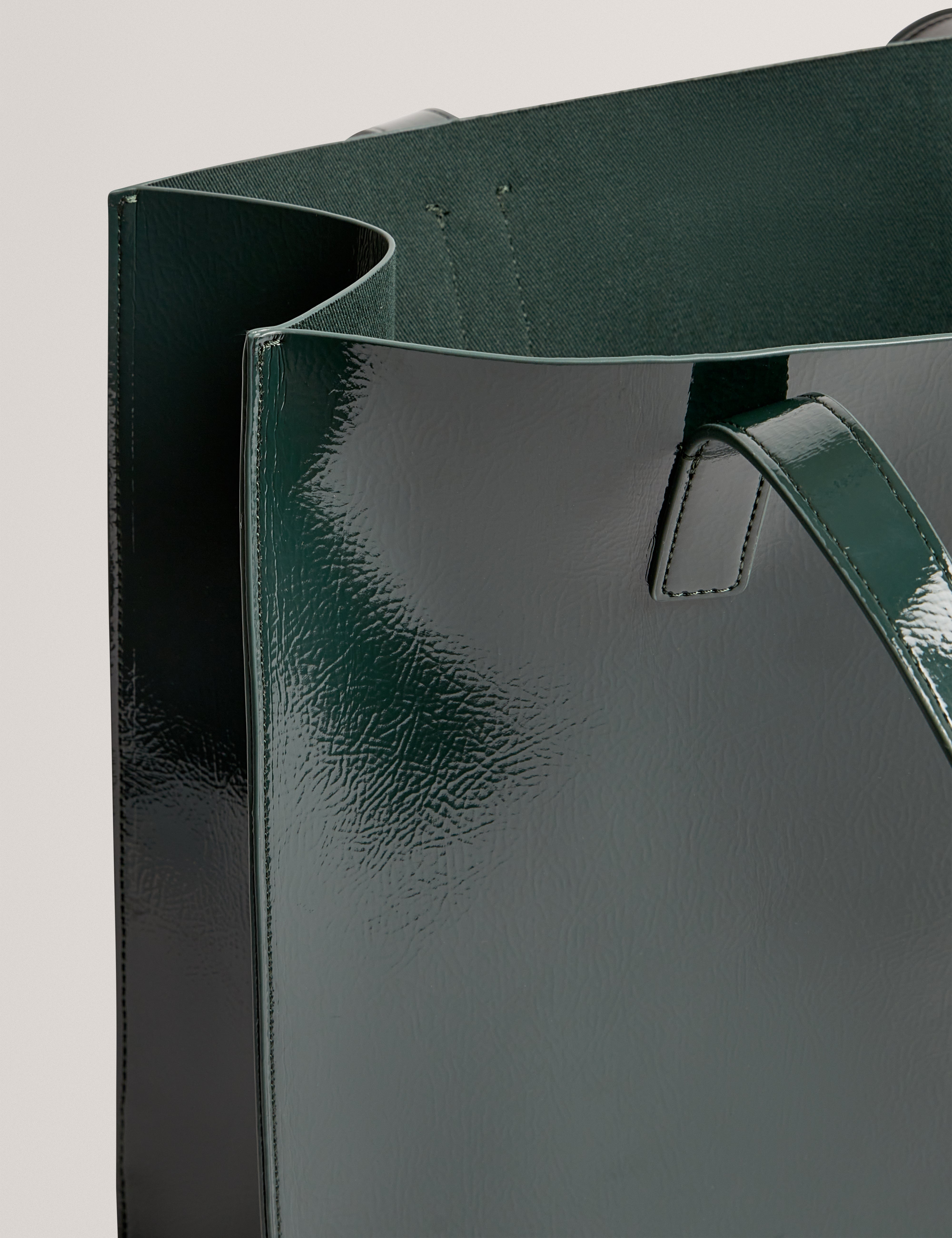 حقيبة يد كبيرة من روزيني بتصميم زهور الورد، لون أخضر داكن.